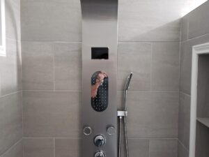 Custom shower with water panel installation