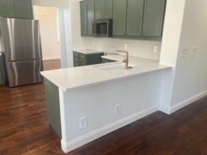 White Quartz with Full Backsplash Peninsula Fabrication & Installation