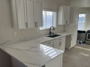 White shaker cabinets with quartz top